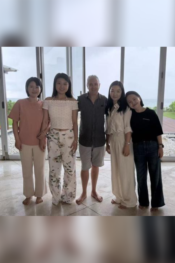 Zenowell team photo at a beachside wellness retreat, capturing collaboration and community spirit