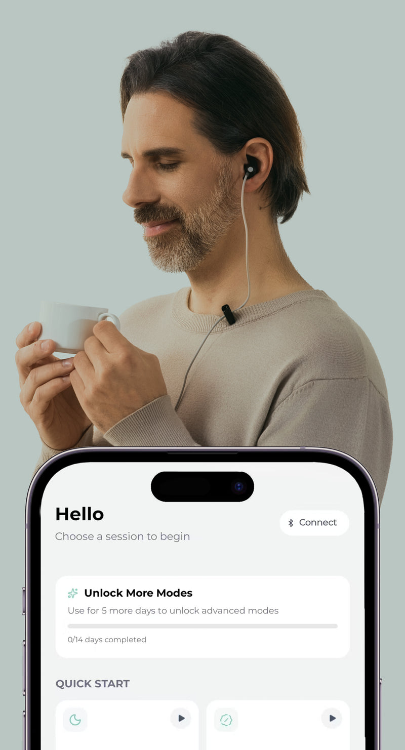 Man using a ZenoWell wearable device during a calm break, holding a cup while the ZenoWell app interface is displayed.