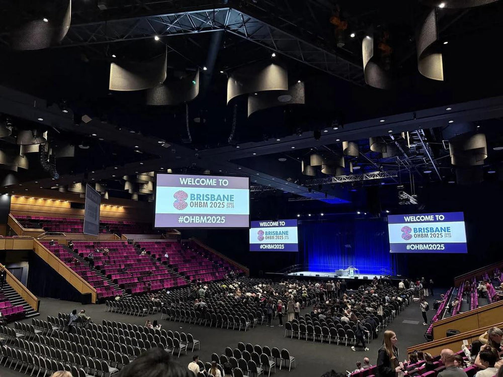 ZenoWell team speaking with attendees at an event